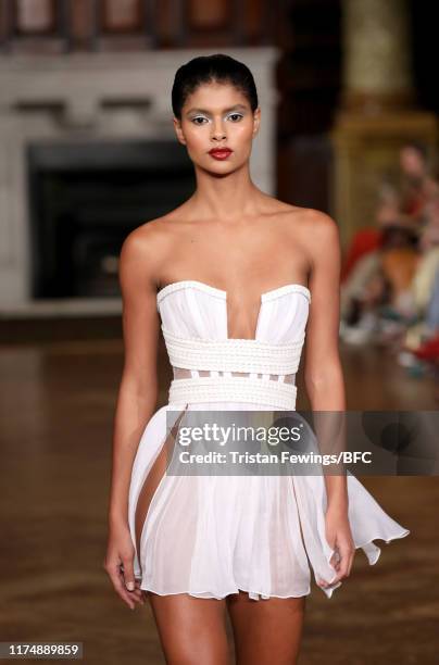 Model walks the runway at the AADNEVIK show during London Fashion Week September 2019 at The Royal Horseguards on September 15, 2019 in London,...