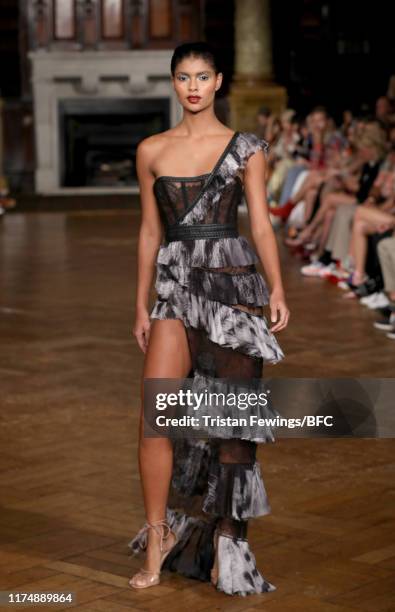 Model walks the runway at the AADNEVIK show during London Fashion Week September 2019 at The Royal Horseguards on September 15, 2019 in London,...
