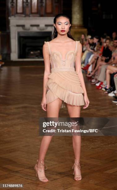 Model walks the runway at the AADNEVIK show during London Fashion Week September 2019 at The Royal Horseguards on September 15, 2019 in London,...