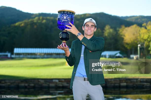 Joaquin Niemann of Chile poses with the trophy after winning A Military Tribute At The Greenbrier held at the Old White TPC course on September 15,...