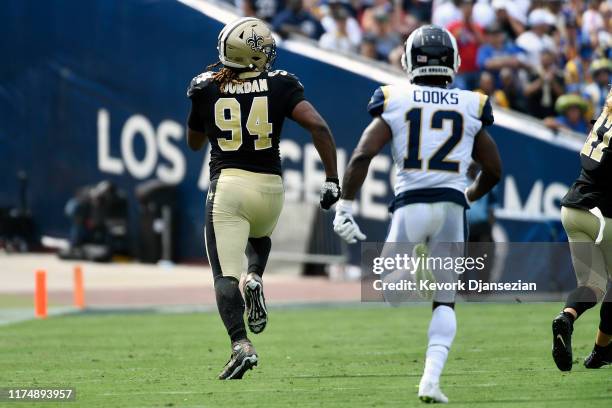 Cameron Jordan of the New Orleans Saints returns a fumble for a touchdown that was nullified due to the play being called an incomplete pass by the...