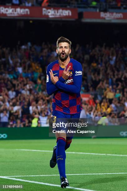 Gerard Pique of FC Barcelona celebrates celebrates as he scores his team's third goal during the La Liga match between FC Barcelona and Valencia CF...