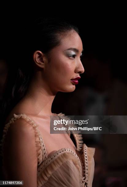 Model backstage at the AADNEVIK show during London Fashion Week September 2019 at The Royal Horseguards on September 15, 2019 in London, England.