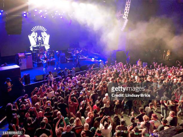 Enthusiastic hometown crowd forms mosh pit as Tom Morello, Tim Commerford, Brad Wilk, Chuck D, B-Real, and DJ Lord perform in Prophets of Rage at The...