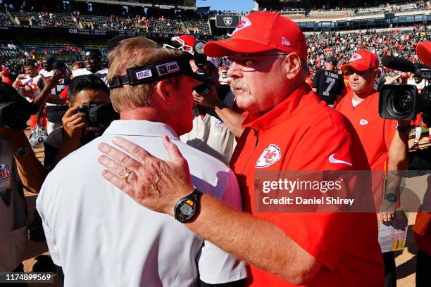 Head coach Andy Reid of the Kansas City Chiefs and head coach Jon Gruden of the Oakland Raiders shake hands after the game at RingCentral Coliseum on...