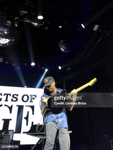 Tom Morello reattaches his guitar as he performs with Tim Commerford, Brad Wilk, B-Real, Chuck D, and DJ Lord in Prophets of Rage at The Mayan...