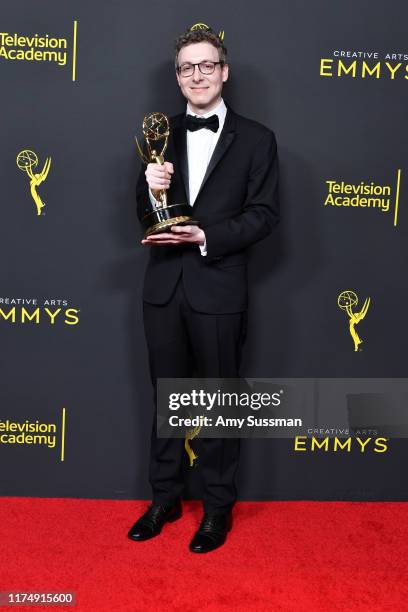 Nicholas Britell poses with the Outstanding Original Main Title Theme Music Award for 'Succession' in the press room during the 2019 Creative Arts...