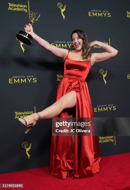 Kathryn Burns poses in the press room with the award for outstanding choreography for scripted programing for "Crazy Ex-Girlfriend" during the 2019...