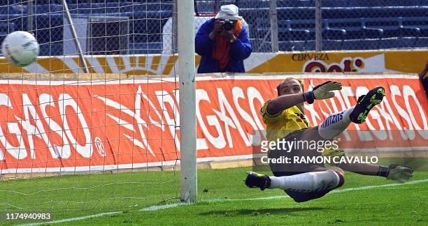 Argentinian Luis Islas unsuccessfully blocks a shot by Atlante's Jose Manuel Abundis during a winter tournament game on August 25, 2001 in Mexico...