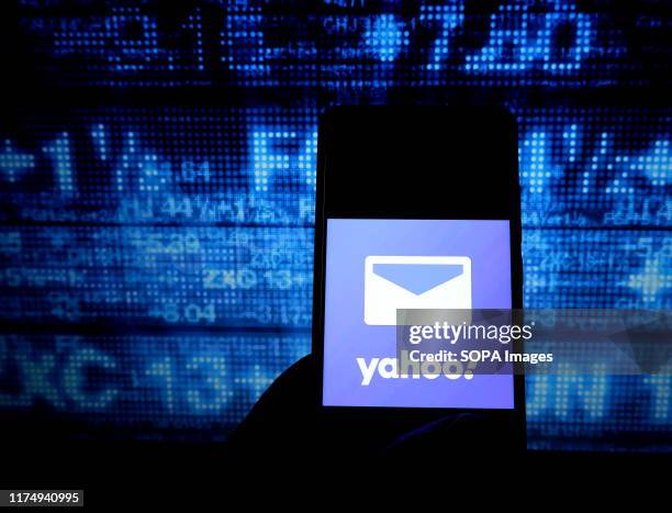 In this photo illustration a popular mail application yahoo mail logo seen displayed on a smartphone.