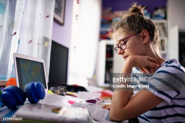 teenage girl doing homework at home - girl desk stock pictures, royalty-free photos & images