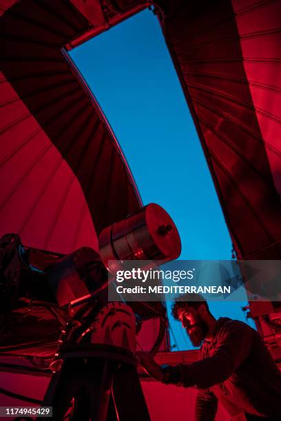 astronomer in photo telescope dome - astronomer stock pictures, royalty-free photos & images