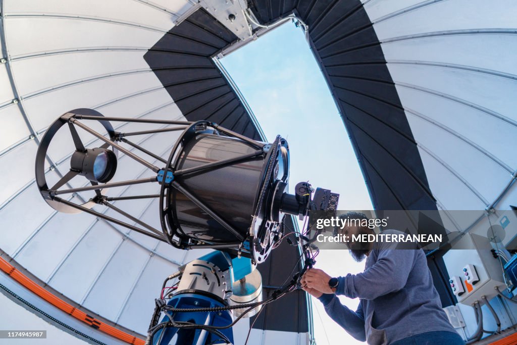 Astronomer in photo telescope dome