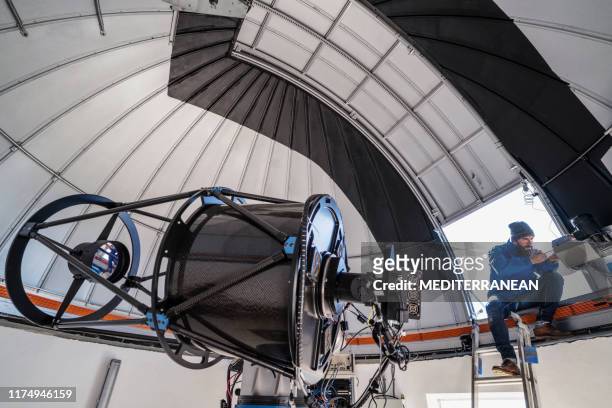 astronomer technician in observatory dome - astronomer stock pictures, royalty-free photos & images
