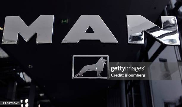 The logo of MAN SE sits on the front of a TGX 26.400 truck during the company's annual shareholders meeting in Munich, Germany, on Monday, June 27,...