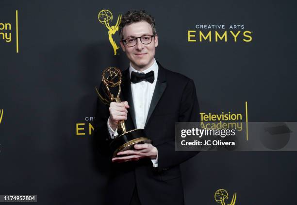 Nicholas Britell poses with the Outstanding Original Main Title Theme Music Award for 'Succession' in the press room during the 2019 Creative Arts...