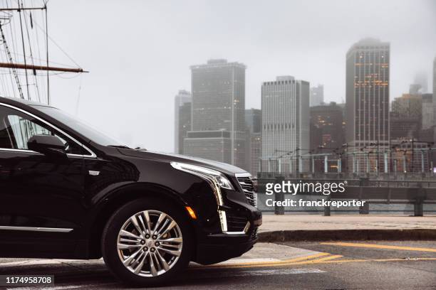 new cadillac xt5 parked on brooklyn heights in new york city - cadillac stock pictures, royalty-free photos & images