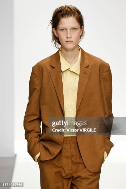 Model walks the runway at the Margaret Howell Ready to Wear Spring/Summer fashion show during London Fashion Week September 2019 on September 15,...