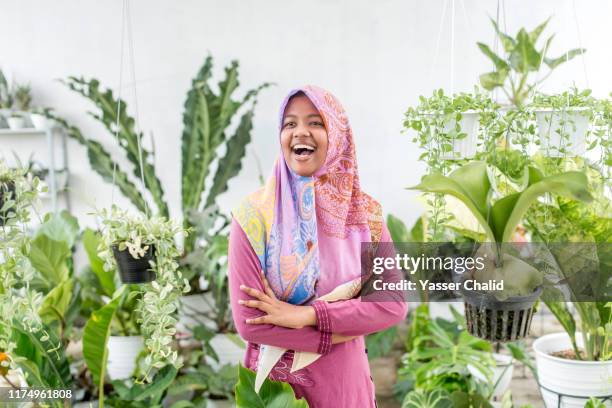 young enterpreneur plant seller - indonesian girl stock pictures, royalty-free photos & images