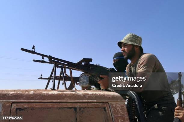 Members of Syrian National Army prepare to enter the territory east of Euphrates River in northern Syria, to support Turkey's Operation Peace Spring,...