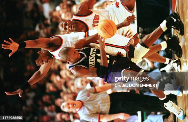 Charlotte Hornets' Glen Rice drives on New York Knicks Patrick Ewing 26 April during their NBA first round play-off game in New York. The Knicks won...