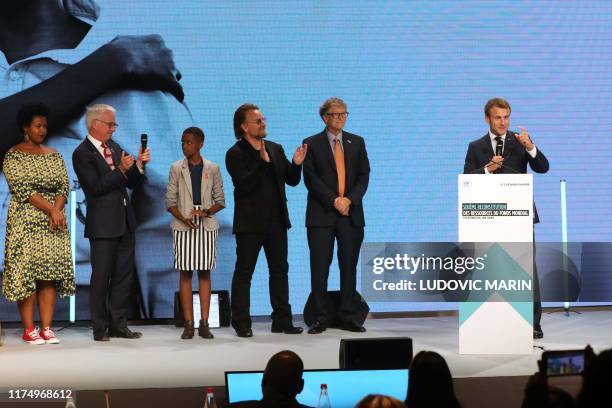 French President Emmanuel Macron delivers a speech next to Microsoft founder and Co-Chairman of the Bill & Melinda Gates Foundation Bill Gates Irish...