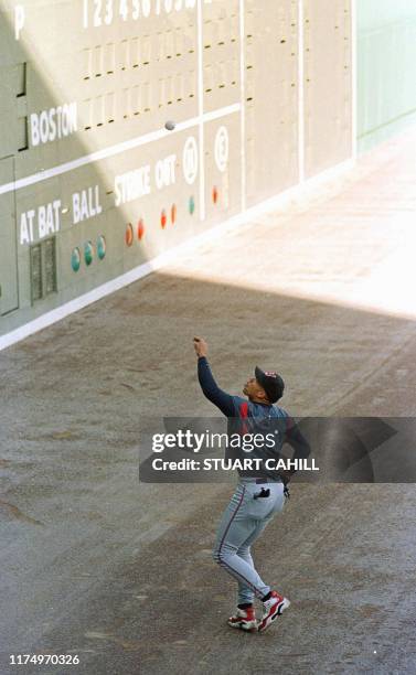 Cleveland Indians player David Justice practices playing fly balls off the legendary Fenway Park Green Monster wall during practice day 01 October...