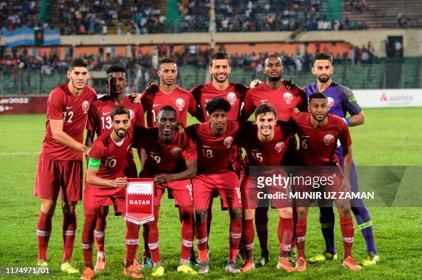 Qatar's players pose for a photo during Asia Group E FIFA World Cup 2022 and the 2023 AFC Asian Cup qualifying football match between Bangladesh and...