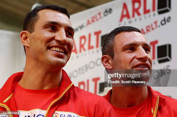 Wladimir Klitschko and and his brother Vitali attend a press conference on June 27, 2011 in Hamburg, Germany to preview the heavy weight title fight...