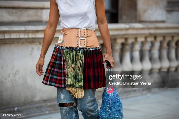Guest is seen wearing belted mini skirt with mixed pattern and multi colors outside Victoria Beckham during London Fashion Week September 2019 on...