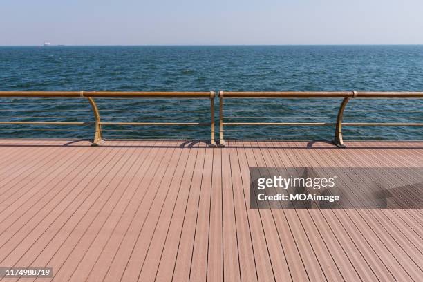 coastal deck,dalian,china - deck stock-fotos und bilder