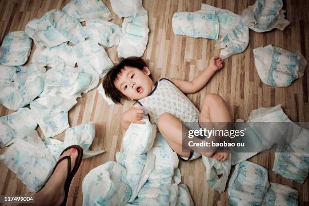 baby boy lying with diapers - nappy stock pictures, royalty-free photos & images