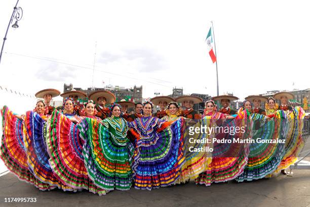 Dancers pose during the celebrations of Mexico's Independence Day at Zocalo on September 15, 2019 in Mexico City, Mexico. This event is also known as...