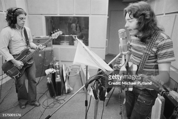 Irish singer and guitarist Rory Gallagher plays an electric guitar with bass guitarist Gerry McAvoy in a recording studio on 23rd July 1973.