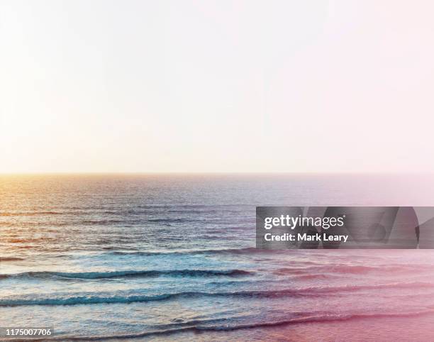 storm affected sea as wind blow the waves and the sun sets - watergate stock pictures, royalty-free photos & images