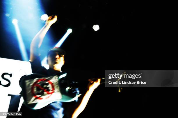 Tom Morello raises his fist, revealing his guitar is emblazoned with a NO NAZIS sign during performance of Prophets of Rage at The Mayan Theater on...