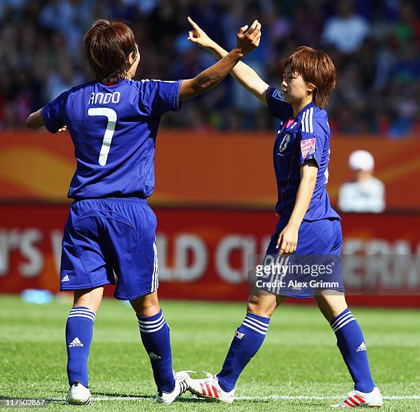 Aya Miyama of Japan celebrates her team's second goal with team mate Kozue Ando during the FIFA Women's World Cup 2011 match between Japan and New...