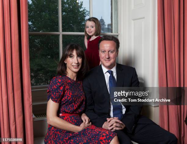 British Prime Minister David Cameron and his wife Samantha photographed with their daughter Florence at 10 Downing Street on October 16, 2013 in...