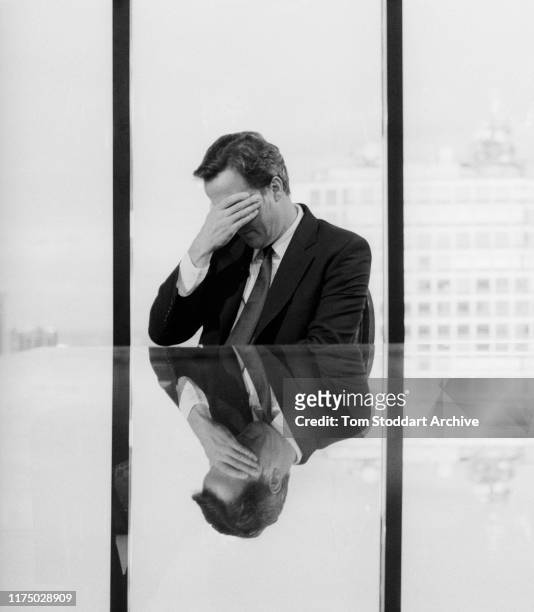 Conservative leader David Cameron rests his eyes during a round of 22 TV interviews held in his hotel suite during the annual party conference in...