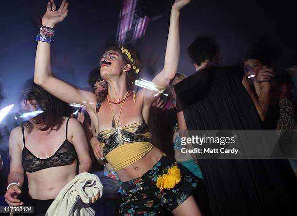 Festival-goers dance in a late night after hours venue London Underground in the Block 9 area at the Glastonbury Festival site at Worthy Farm, Pilton...