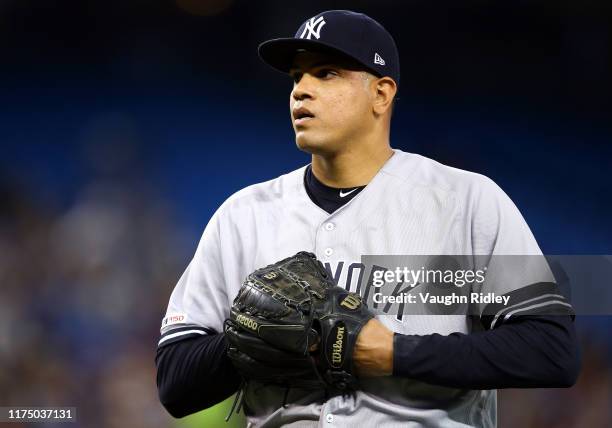 Dellin Betances of the New York Yankees walks back to the dugout in the fourth inning during a MLB game against the Toronto Blue Jays at Rogers...