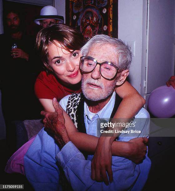 American actress Winona Ryder embraces her godfather psychologist Dr Timothy Leary at his Good Friday gathering on April 5, 1996 in Beverly Hills,...