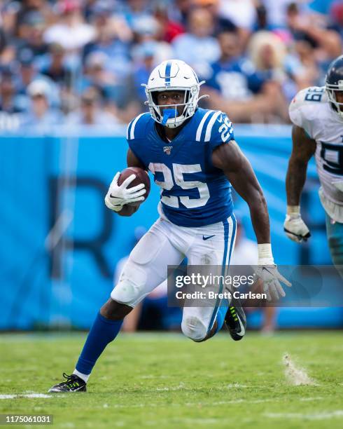 Marlon Mack of the Indianapolis Colts runs with the ball during the fourth quarter against the Tennessee Titans at Nissan Stadium on September 15,...