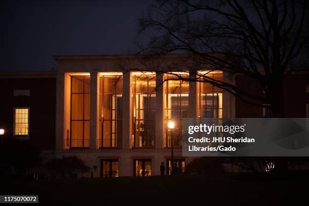 Night shot of the interior lighted facade of the Milton S Eisenhower Library at the Johns Hopkins University, Baltimore, Maryland, April, 2009. From...