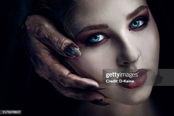 creepy portrait of beautiful woman - devil woman stock pictures, royalty-free photos & images