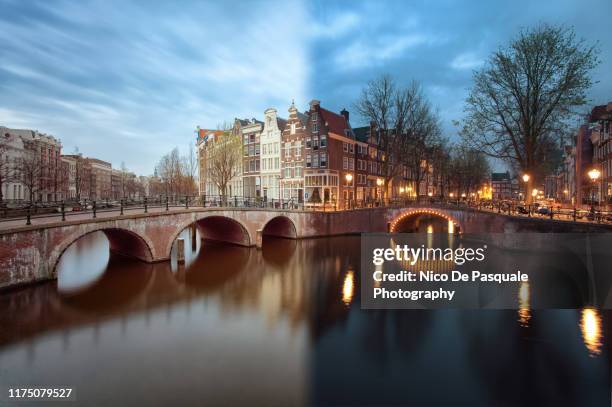 amsterdam from day to night - time of day stock pictures, royalty-free photos & images