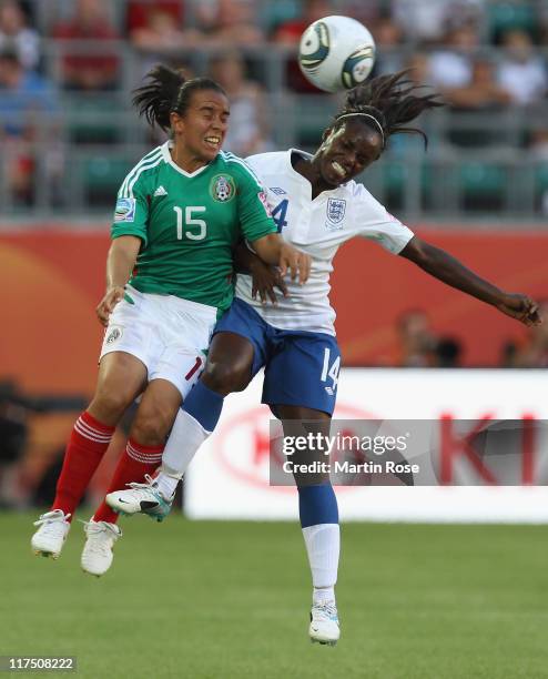 Luz del Rosario Saucedo of Mexico and Eniola Aluko of England head for the ball during the FIFA Women's World Cup 2011 Group B match between Mexico...