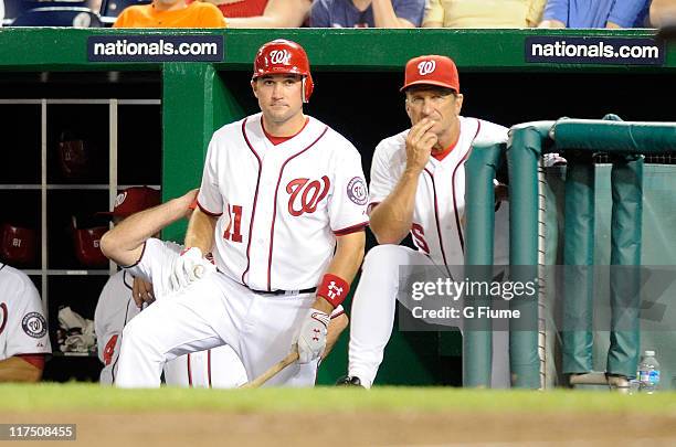 Manager Jim Riggleman and Ryan Zimmerman of the Washington Nationals watch the game against the Baltimore Orioles at Nationals Park on June 17, 2011...