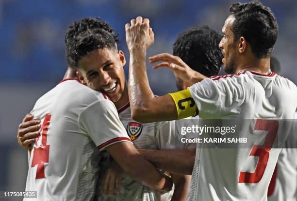 S midfielder Khalil Ibrahim celebrates with his teammates after scoring a goal during the World Cup Qatar 2022 Group G qualification football match...