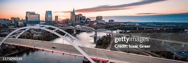 nashville downtown sunset aerial panorama - nashville downtown district stock pictures, royalty-free photos & images